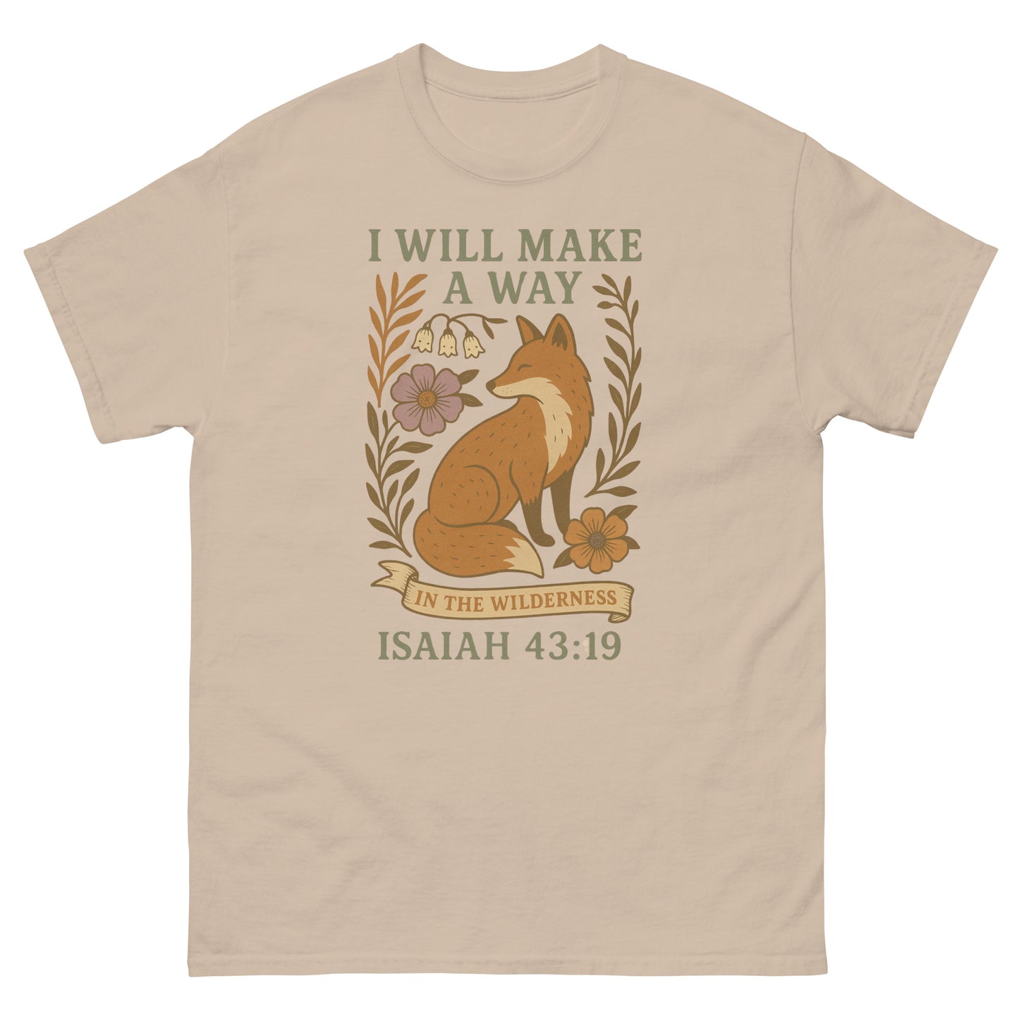 Christian T-shirt featuring a sitting fox surrounded by flowers and leaves, with the Bible verse 'I will make a way in the wilderness – Isaiah 43:19' in decorative text. Front, Sand color