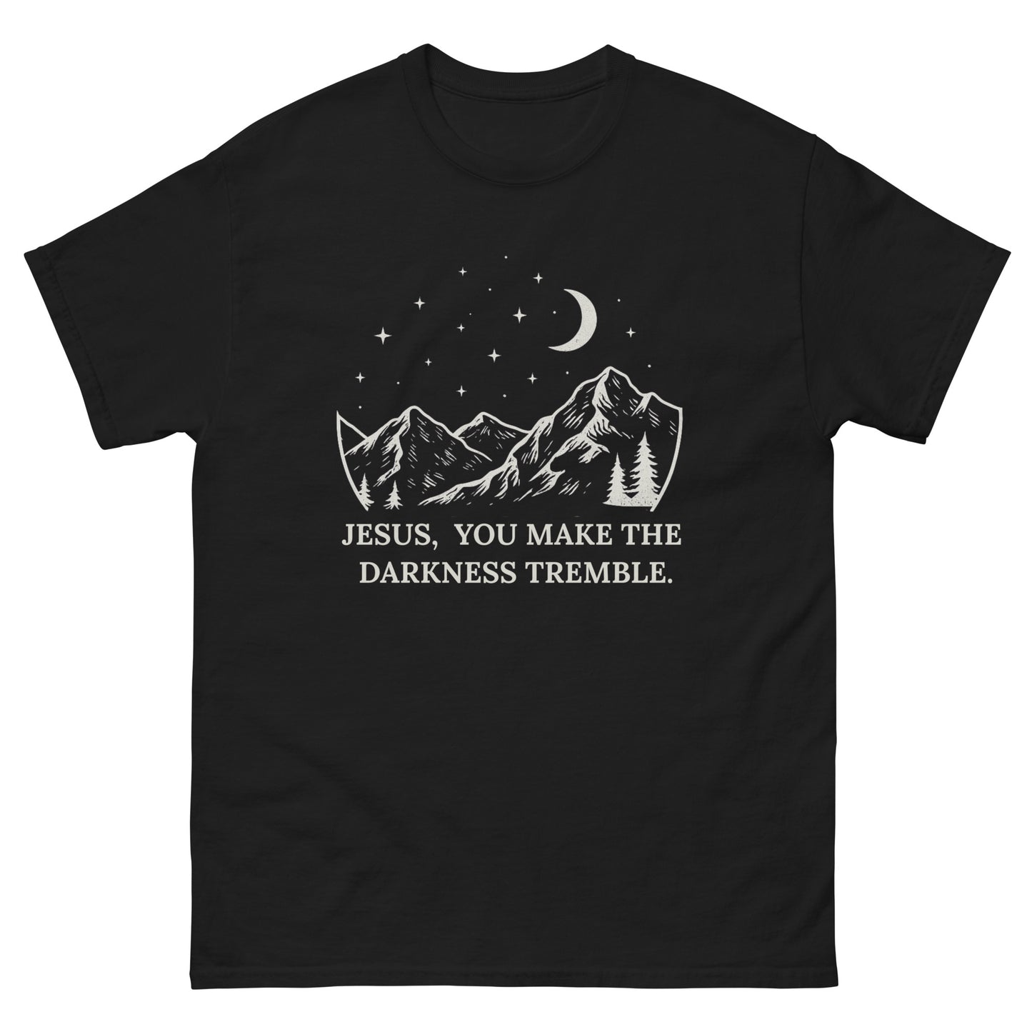 unisex T-shirt featuring a white line-art design of mountains, trees, crescent moon, and stars. Below the artwork, the text reads: "Jesus, You Make the Darkness Tremble." front, black