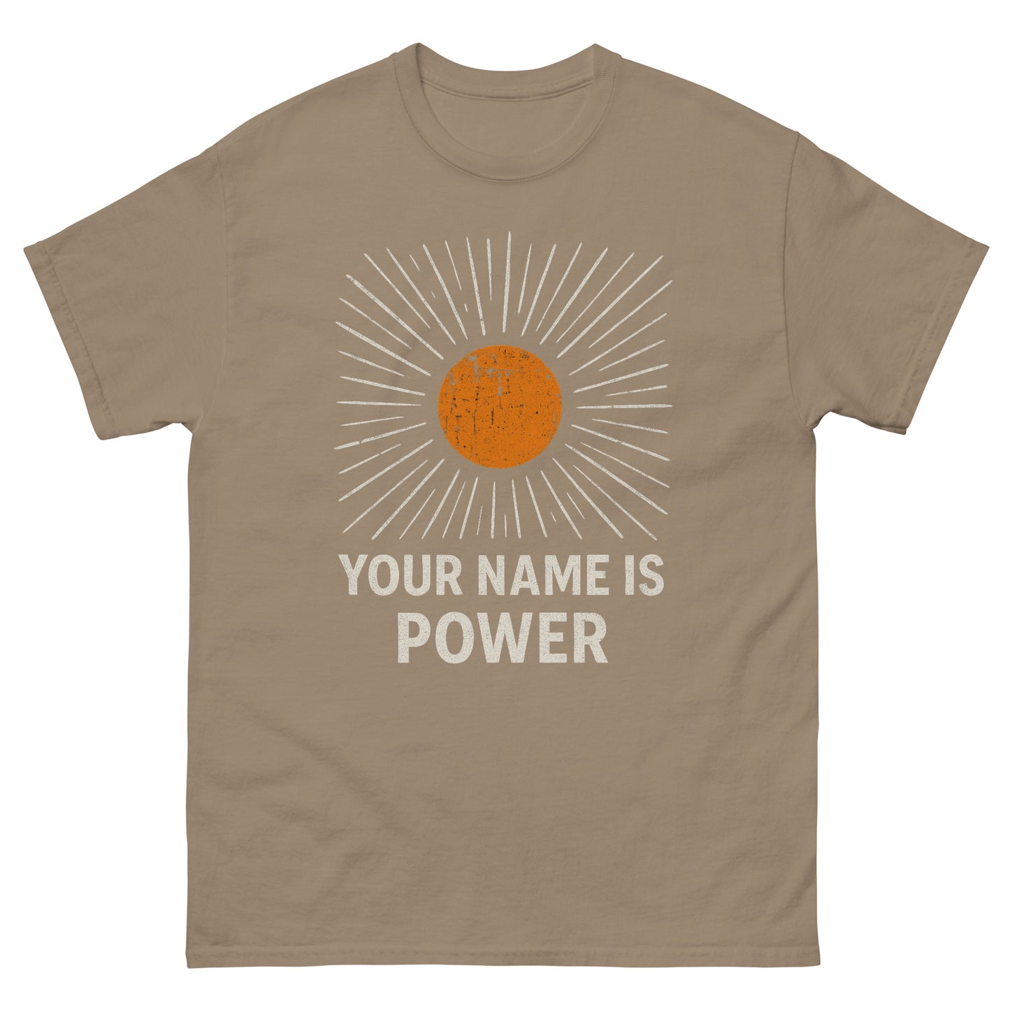 T-shirt with a distressed orange sun graphic radiating white rays, above bold text that reads: "YOUR NAME IS POWER." Front, Brown