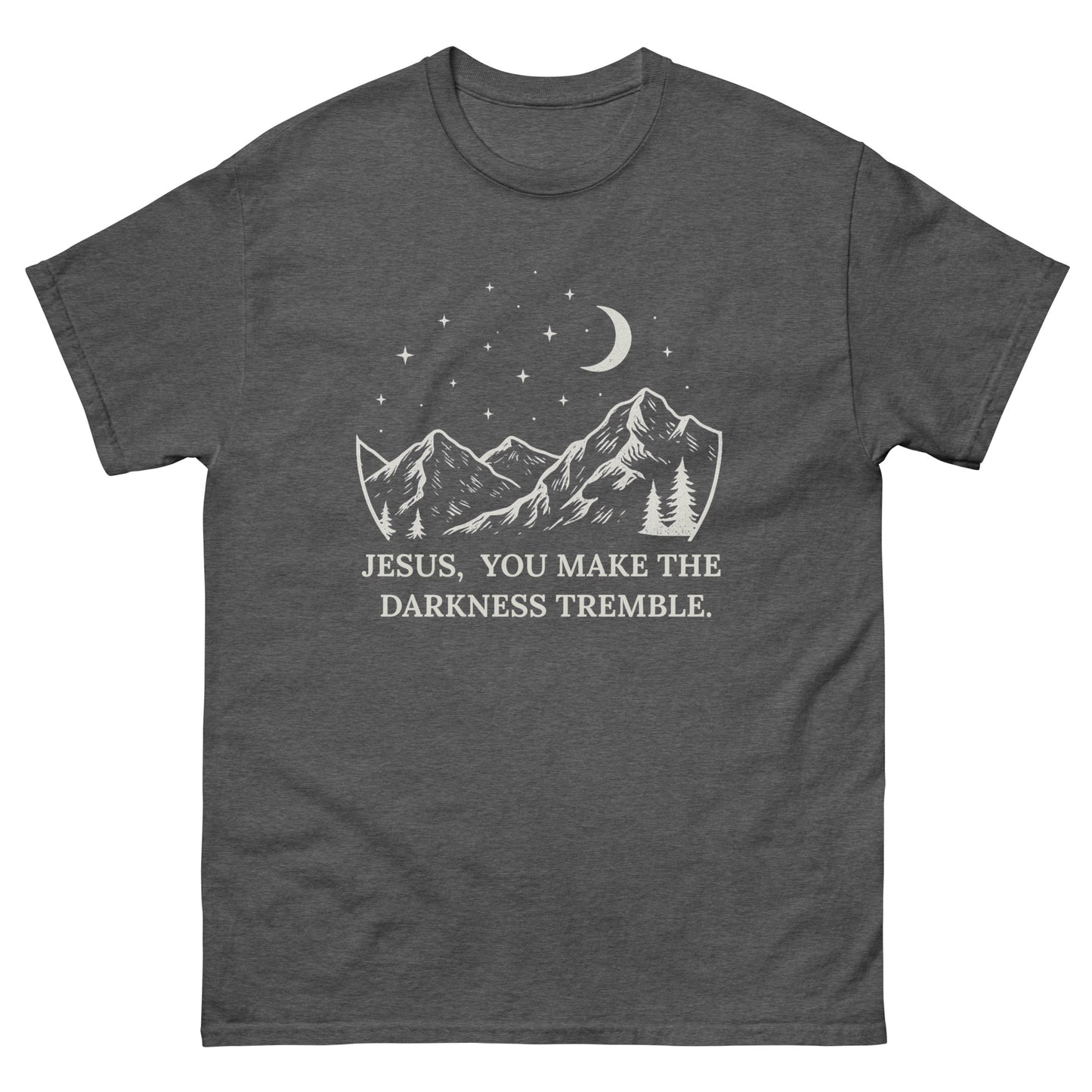 unisex T-shirt featuring a white line-art design of mountains, trees, crescent moon, and stars. Below the artwork, the text reads: "Jesus, You Make the Darkness Tremble." Front, Dark gray