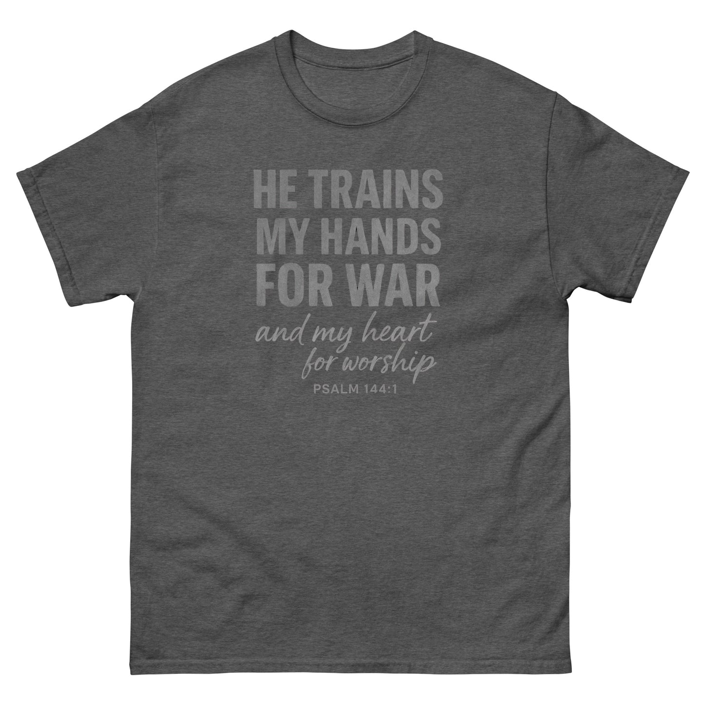 Front, Dark Heather t-shirt with bold white text reading “He trains my hands for war and my heart for worship – Psalm 144:1,” designed for faith-based wear.