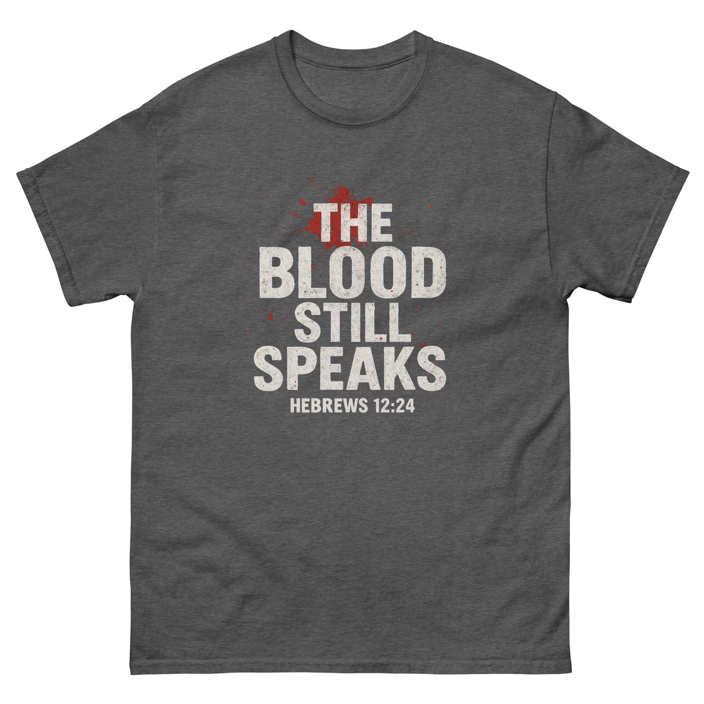 Front, Dark Heather t-shirt with bold white and red text reading “The Blood Still Speaks – Hebrews 12:24,” Christian faith shirt with splatter graphic.