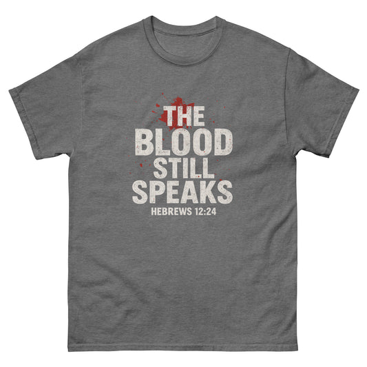 Front, graphite heather  t-shirt with bold white and red text reading “The Blood Still Speaks – Hebrews 12:24,” Christian faith shirt with splatter graphic.