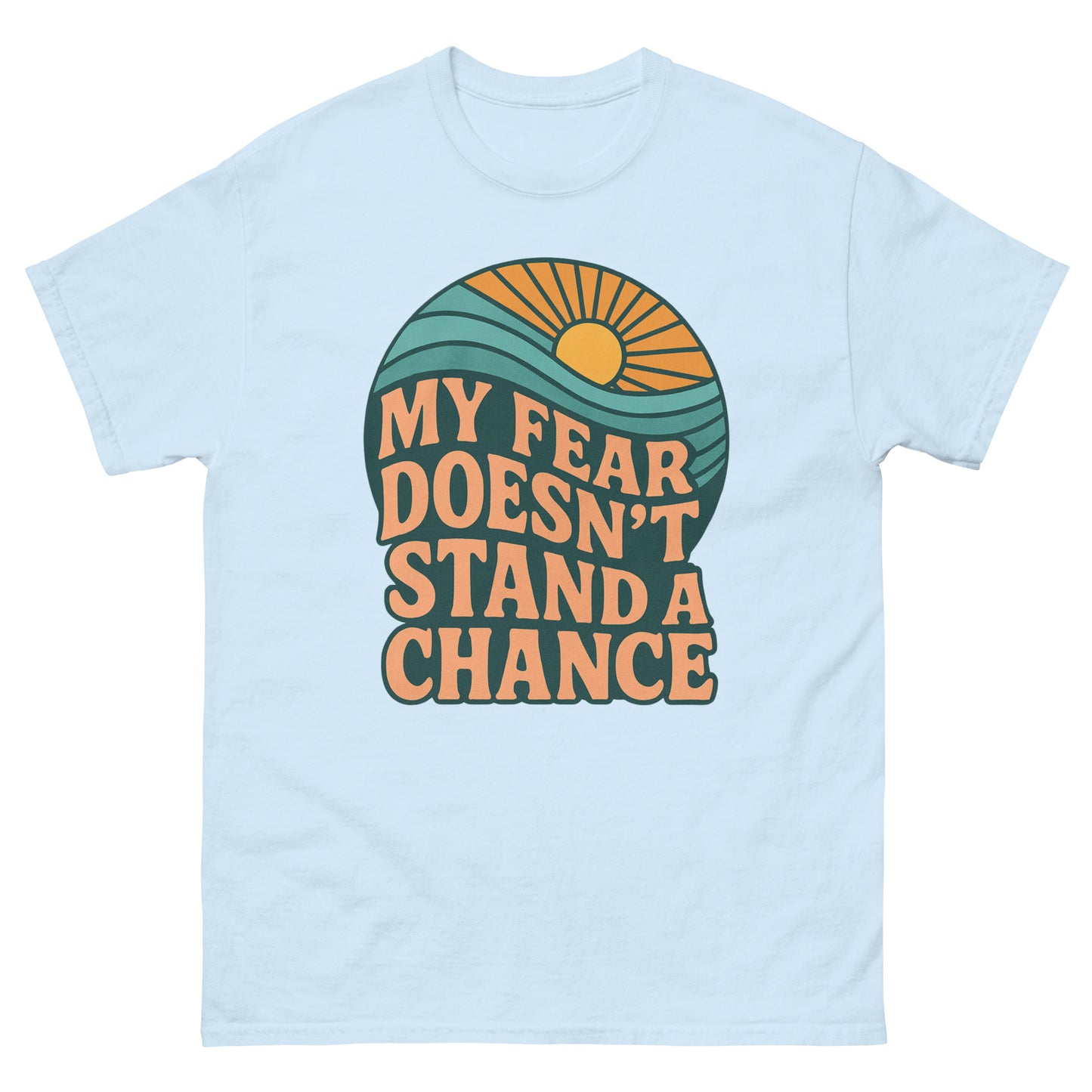 T-shirt with a retro-style design featuring a sun rising over waves and the bold text “MY FEAR DOESN’T STAND A CHANCE” in orange and dark teal. Front, Light Blue