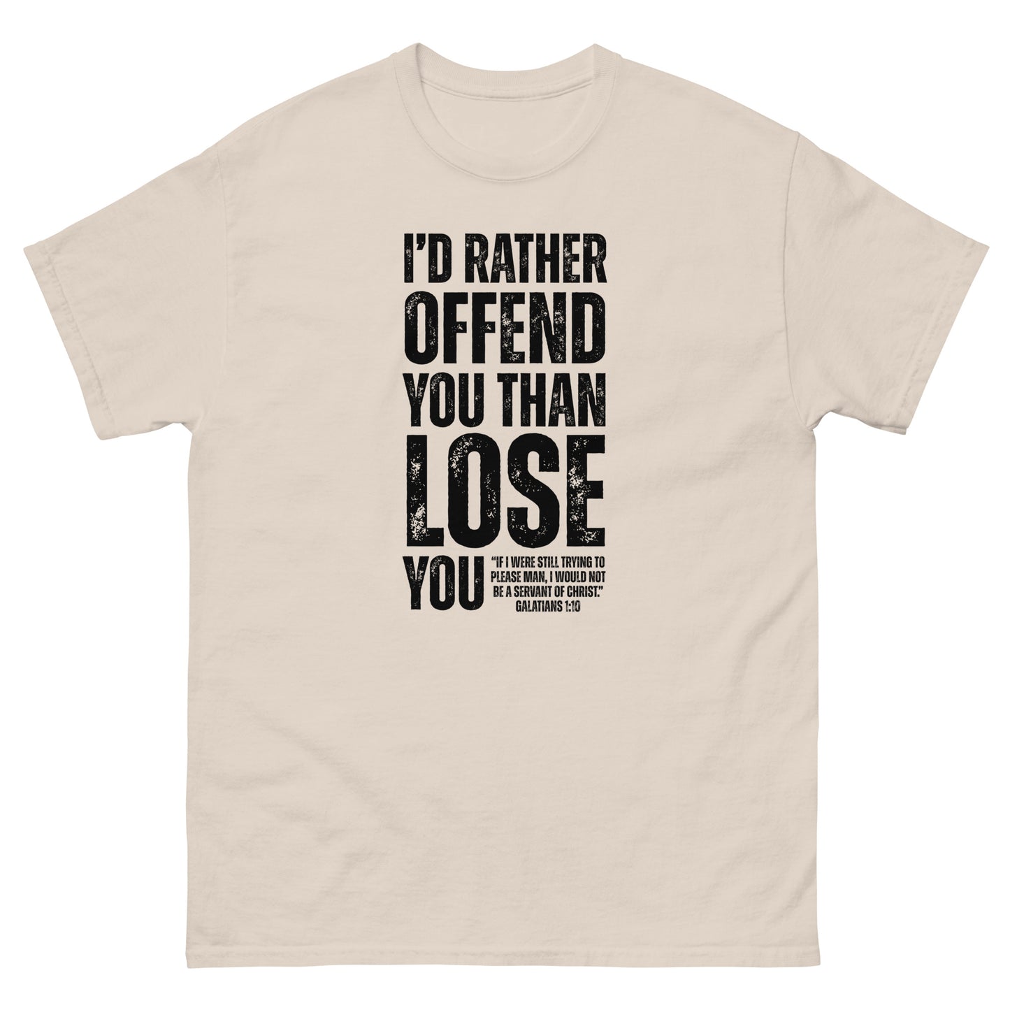 Natural-colored t-shirt with bold black text reading “I’D RATHER OFFEND YOU THAN LOSE YOU” and a smaller quote from Galatians 1:10 below the main message.