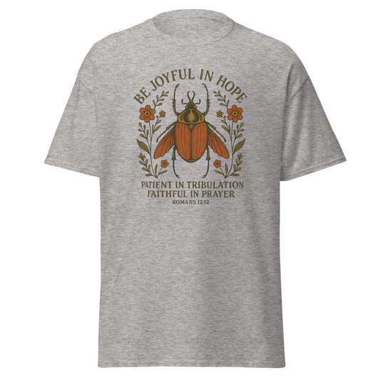 Joyful Bug Boho Women's T-shirt featuring Romans 12:12 with a whimsical beetle and floral design, symbolizing joy, patience, and faith, ash color, front